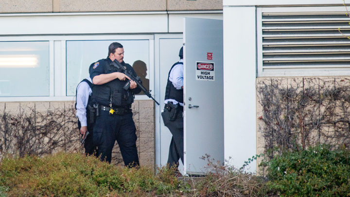 Police search a building at YouTube's corporate headquarters as an active shooter situation was underway in San Bruno, California on April 03, 2018.                          
Gunshots erupted at YouTube's offices in California Tuesday, sparking a panicked escape by employees and a massive police response, before the shooter -- a woman -- apparently committed suicide.Police said three people had been hospitalized with gunshot injuries following the shooting in the city of San Bruno, and that a female suspect was found dead at the scene. 
